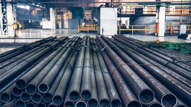 Close-up view of steel pipes in Iron and Steel Factory or Pipe Mill located in Taganrog South of Russia waiting for shipment in warehouse